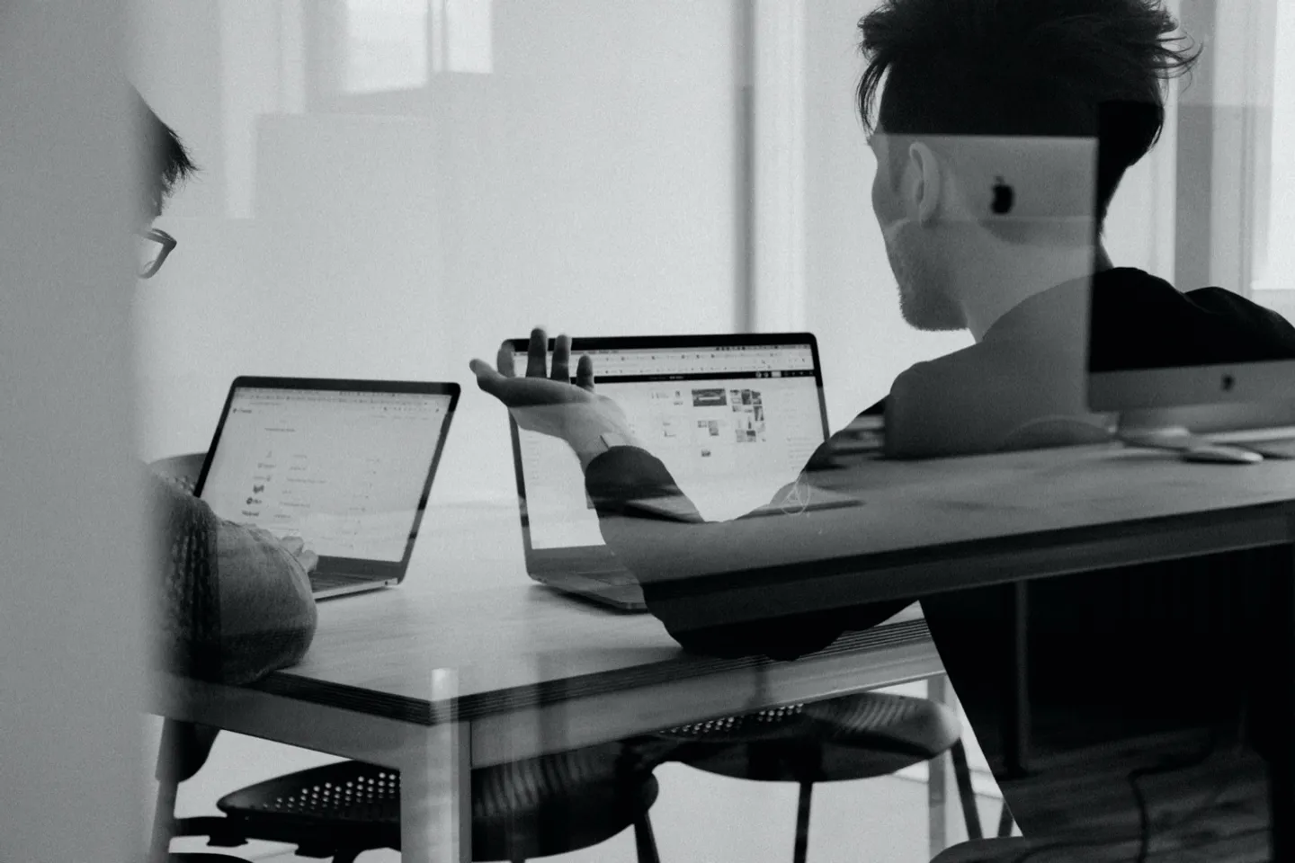 Working at a desk in an open-plan office