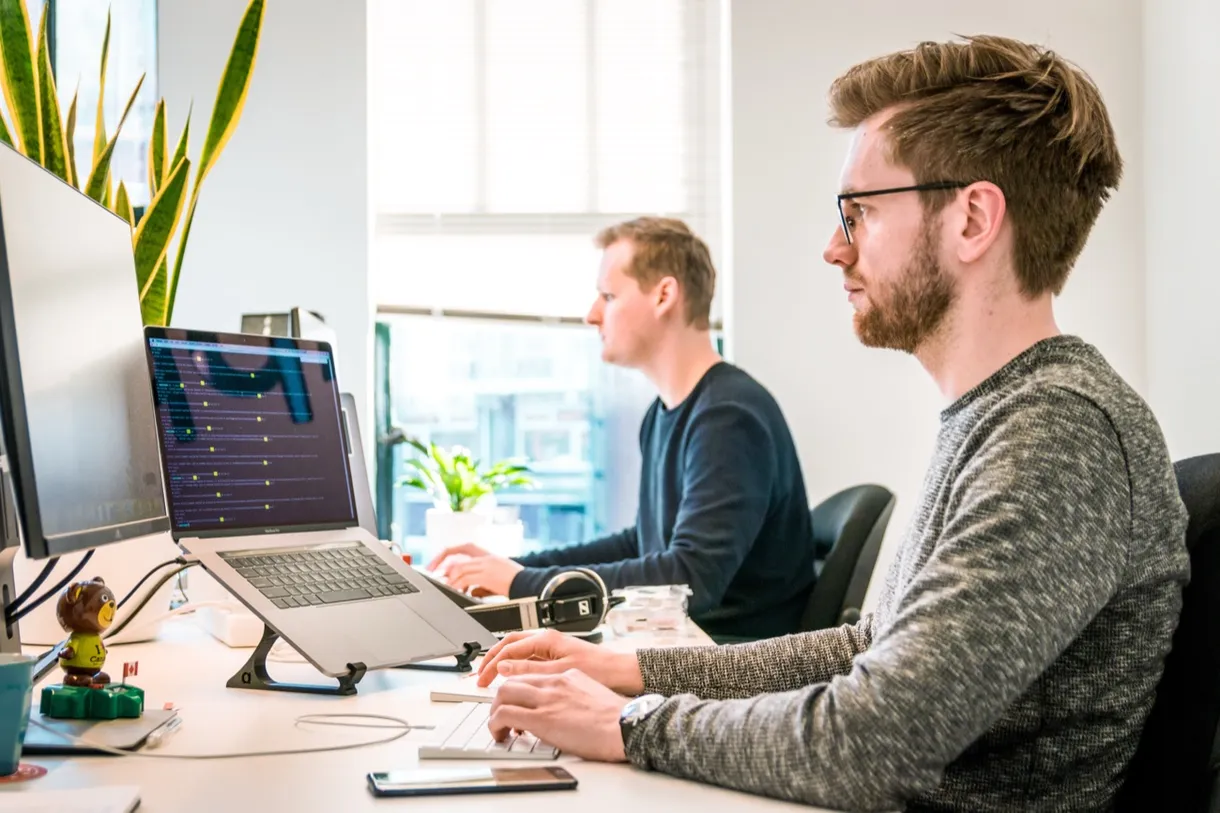 Engineer at a multi-monitor workstation
